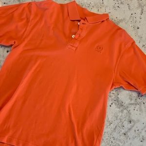 Orange Izod polo.